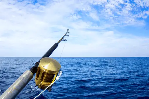 boat fishing rod cast into the ocean