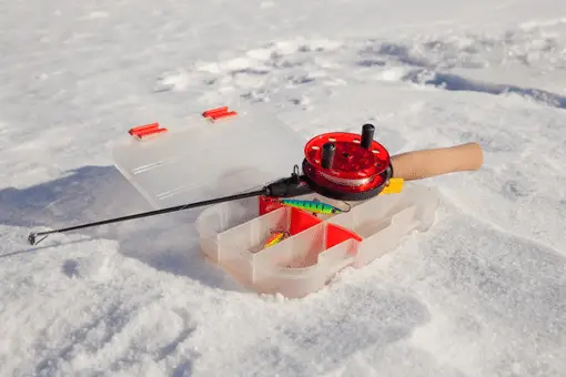ice fishing rod on bed of snow