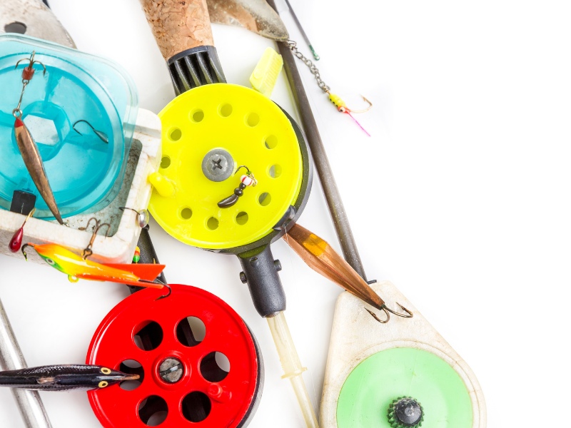 various pieces of fishing tackle on a white background